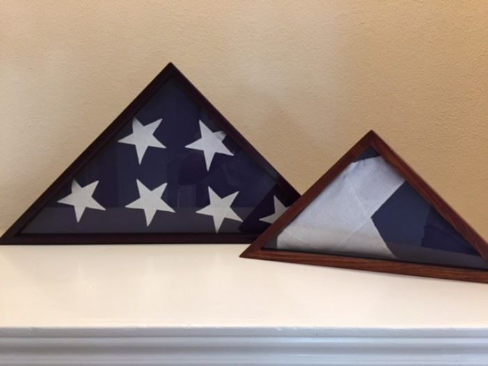 U.S. and Texas presentation flags in wood/glass cases.
