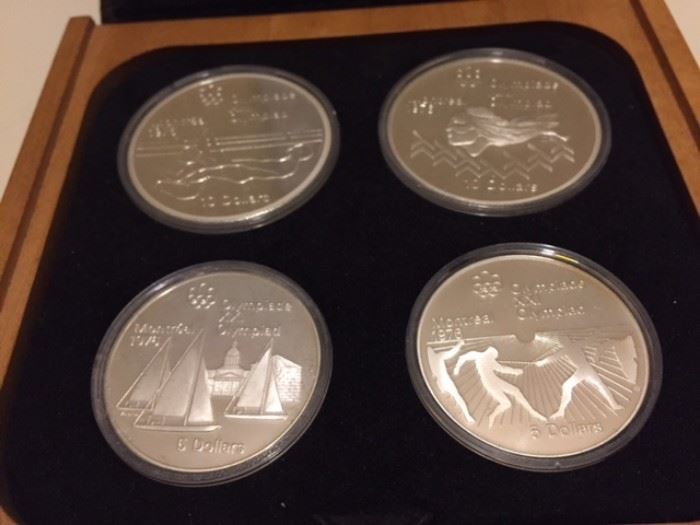 Six 1976 Montreal Olympic coin sets with certificates.  92.5% silver content.  $10 coins  have 1.44 Troy ounces of fine silver.  $5 coins have 0.72 oz.