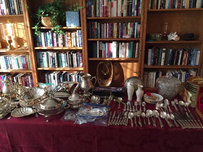 Silver place settings and serving pieces, bookcases, books, books and more books!