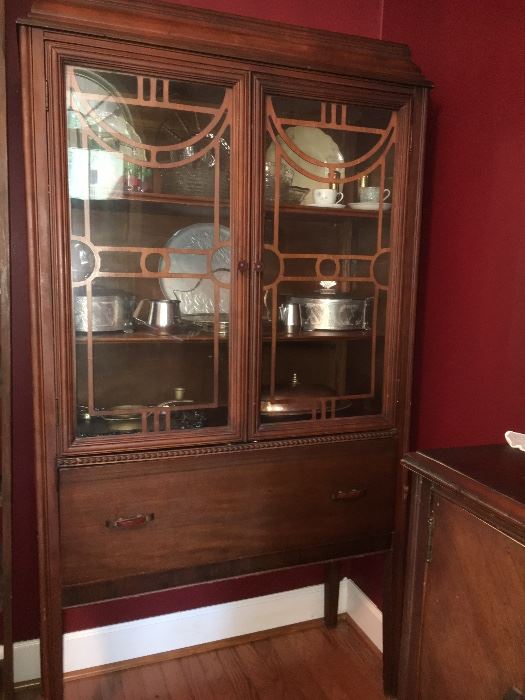 Vintage 1940s walnut dining room group includes table and 5 chairs, buffet and china cabinet. (Veneer is loose on buffet.)