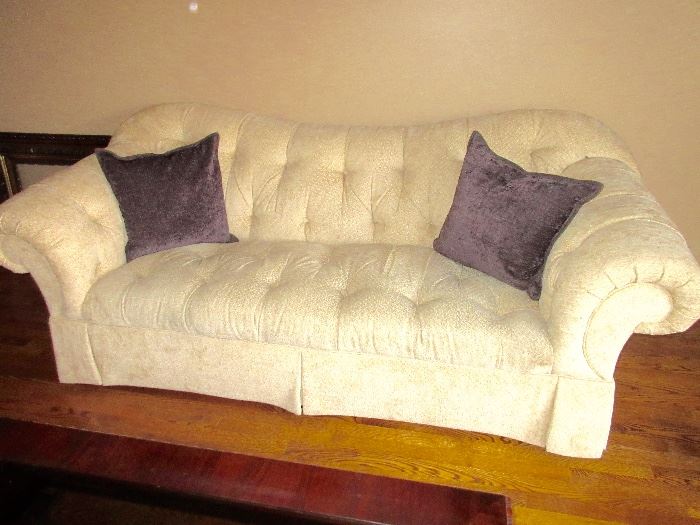 wonderful cream  colored sofa, interesting design and shape.