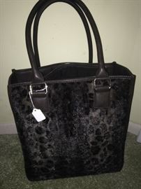 Leopard print bag has a leopard print throw within