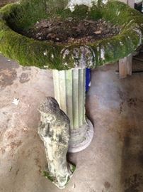 One of two bird baths complete with moss