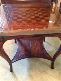 The two level game table has a drawer on each side.