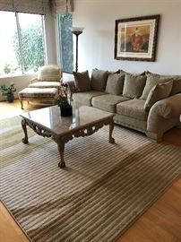 Marble topped coffee table, Bergere chair, sofa and wool rug