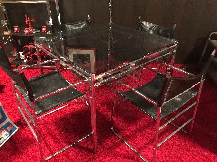 Chrome glass top table with chrome and leather chairs