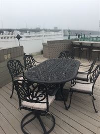 Black iron patio set with 6 chairs 