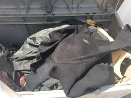 Bin of wet suits & life preservers