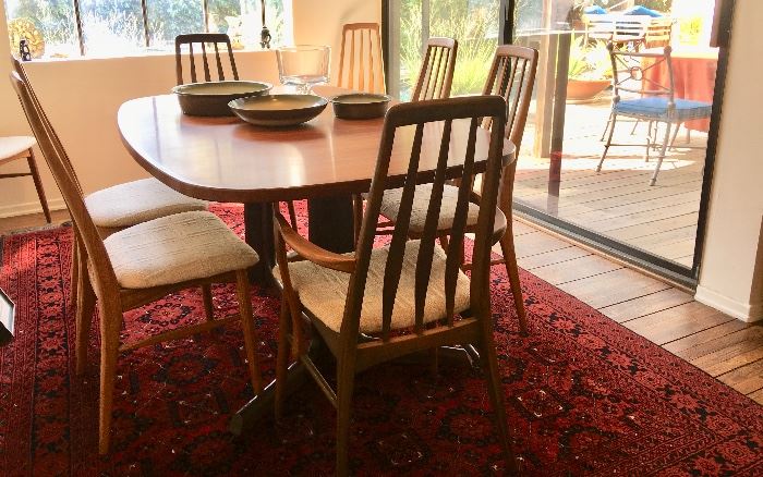 Mid-Century Modern Danish Rosewood Dining Table and 8 Chairs by Koefodes Hornslet ; Designed by Niels Koefodes in 1964  ("Eva" Chairs)