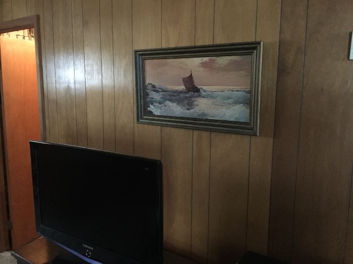 flat screen tv and wall art