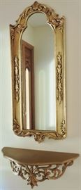 Sold. Gilt wood mirror; shelf
