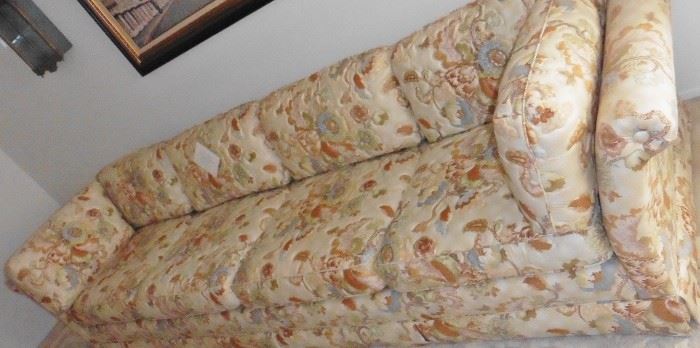 Long couch with Asian inspired fabric. Great condition!