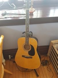 Guitar with stand - still has the box.
