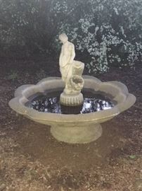 giant concrete bird bath with flowing water