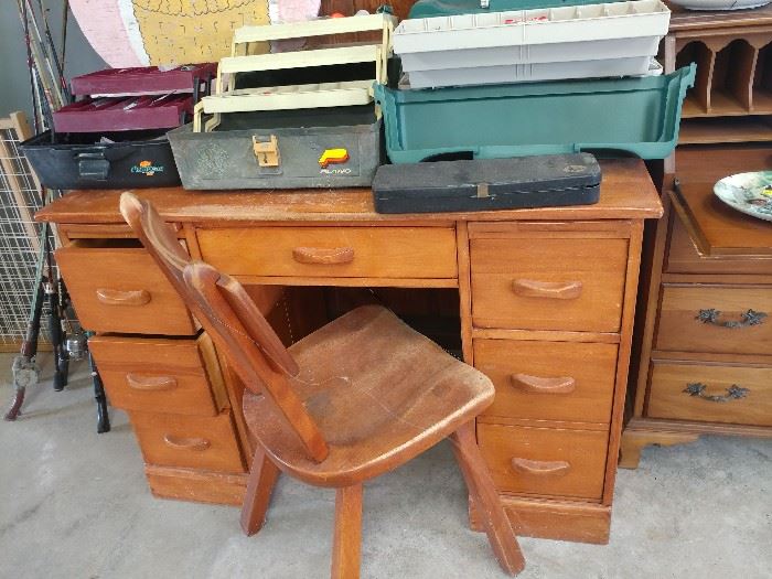 wood office desk, wood chair, tackle boxes