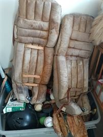 vintage catcher's knee pads, baseball equipment, baseball gloves