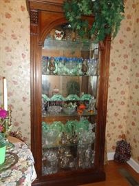 curio cabinet, filled with glass ware