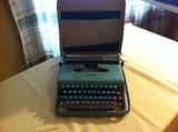 Lettera 22 Portable Typewriter. Vintage portable typewriter in hard canvas case.