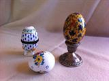 White and Blue Egg opens to hold small itmes. Yellow and blue egg with birds, white, flowered egg porcelin.
