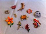 Vintage pins broaches. Turtle, swordfish, leaf, pointsettia, butterfly, girl running, fish, cat, flower, circle, smiley face.