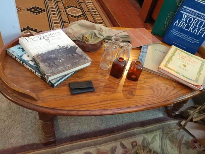 coffee table, bottles, books