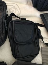 Loads of Womens Purses and Back packs with names such as Borgo Giovanni, Sharper Image, Dooney and Bourke, and of course Coach