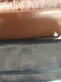 Loads of Womens Purses and Back packs with names such as Borgo Giovanni, Sharper Image, Dooney and Bourke, and of course Coach