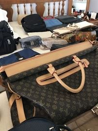 Loads of Womens Purses and Back packs with names such as Borgo Giovanni, Sharper Image, Dooney and Bourke, and of course Coach