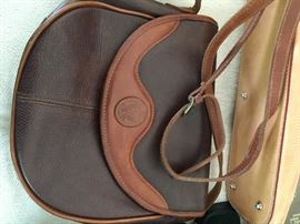 Loads of Womens Purses and Back packs with names such as Borgo Giovanni, Sharper Image, Dooney and Bourke, and of course Coach