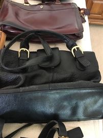 Loads of Womens Purses and Back packs with names such as Borgo Giovanni, Sharper Image, Dooney and Bourke, and of course Coach