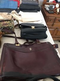 Loads of Womens Purses and Back packs with names such as Borgo Giovanni, Sharper Image, Dooney and Bourke, and of course Coach