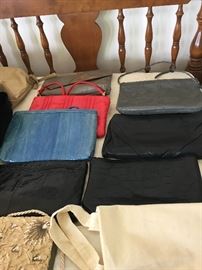 Loads of Womens Purses and Back packs with names such as Borgo Giovanni, Sharper Image, Dooney and Bourke, and of course Coach