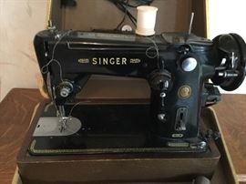 Cased sewing machine is a Singer Featherweight 301W