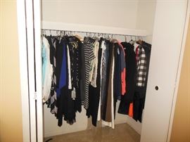 Lots of designer clothes , purses and shoes