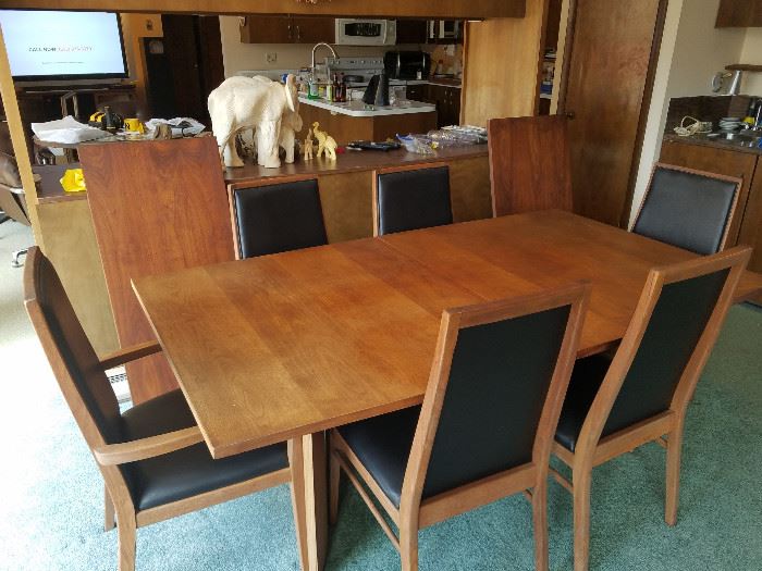 Mid century dining table and chairs with 2 leafs by Foster McDavid. 42 x 72 as pictured. 2 - 20" leafs. Table naturally faded. Leafs are darker being stored away from sunlight