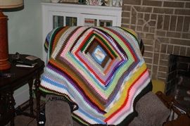 Knitted afghan, multicolored. A number of them in the sale.