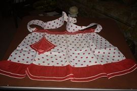 Starched, ironed, put away for the next meal preparation, lovely polka dot with organdy trim.