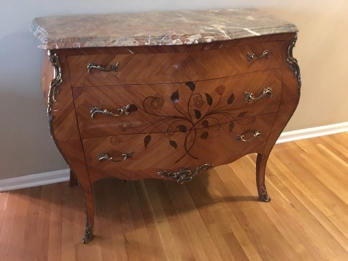 Fabulous antique Bombe chest with beautiful marble top and inlay details. Great condition except for some veneer chipping on two of the legs.