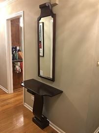 Wonderful vintage 1960s hall table and mirror set which was professionally refinished to a dark mahogany color from the original bleached cream and gold finish. Great condition except for some surface scratching on the table top.