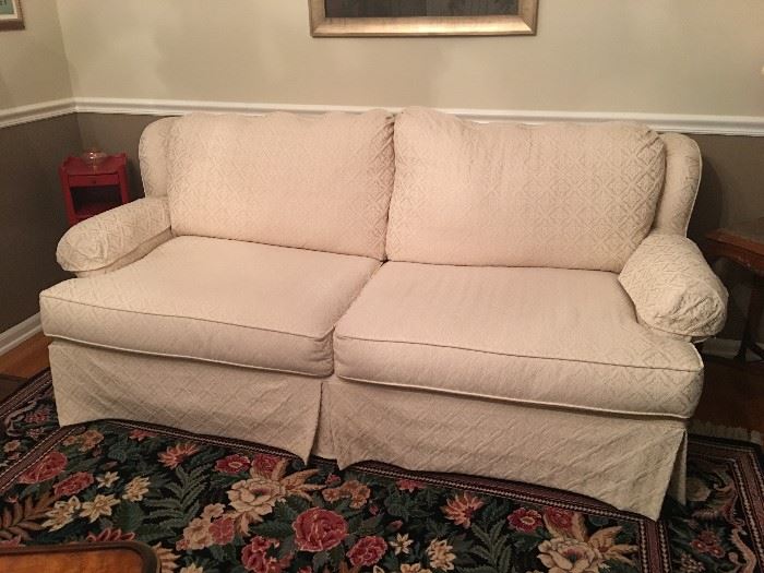 Comfortable love seat with cream color jacquard fabric, rarely used and in great condition