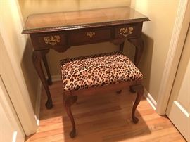 Early-American style vanity with custom-cut glass top and matching stool with leopard print UltraSuede fabric