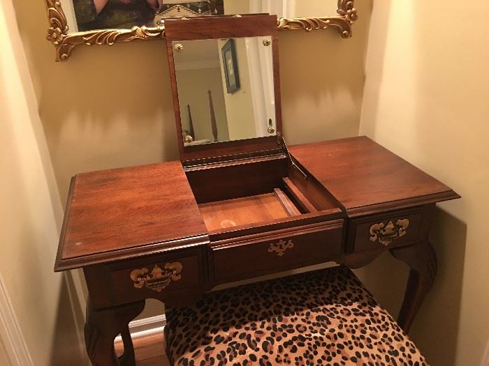 When glass top is removed, the vanity mirror can be raised