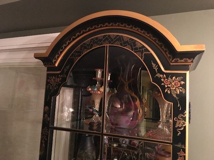 Closeup of Chinoiserie-style lighted curio cabinet