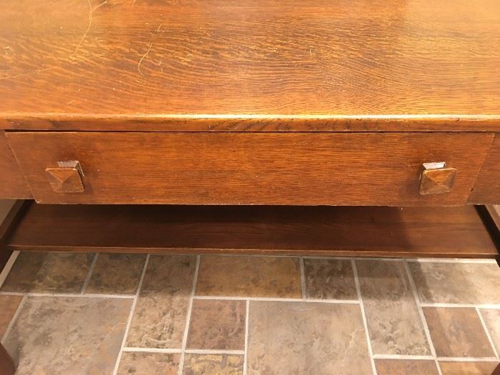 Closeup of antique library table drawer