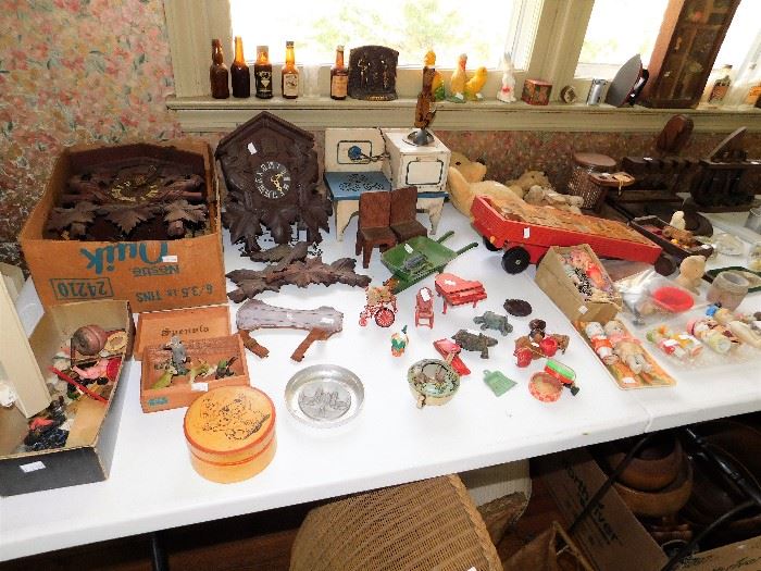 Cuckoo Clocks, tine toys, wooden vintage toys, miniature bottles. 