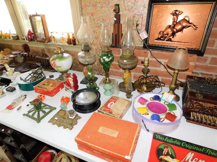 Many vintage oil lamps to choose from. 