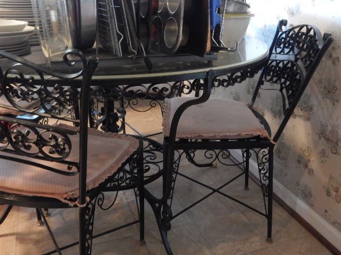 Lovely wrought iron round table with chairs. 