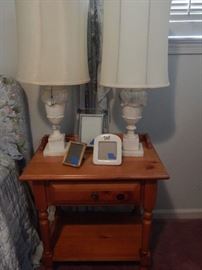 Pine wood night stand with pair of alabaster lamps.