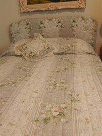 Double bed with padded head board.