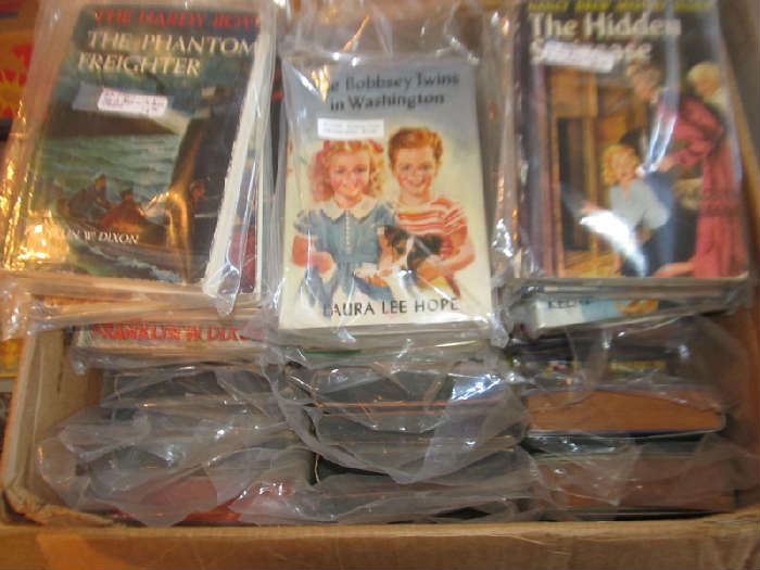 Over 50 juvenile books including Nancy Drew, Hardy Boys, Bobbsey Twins - all in original dust jackets.  